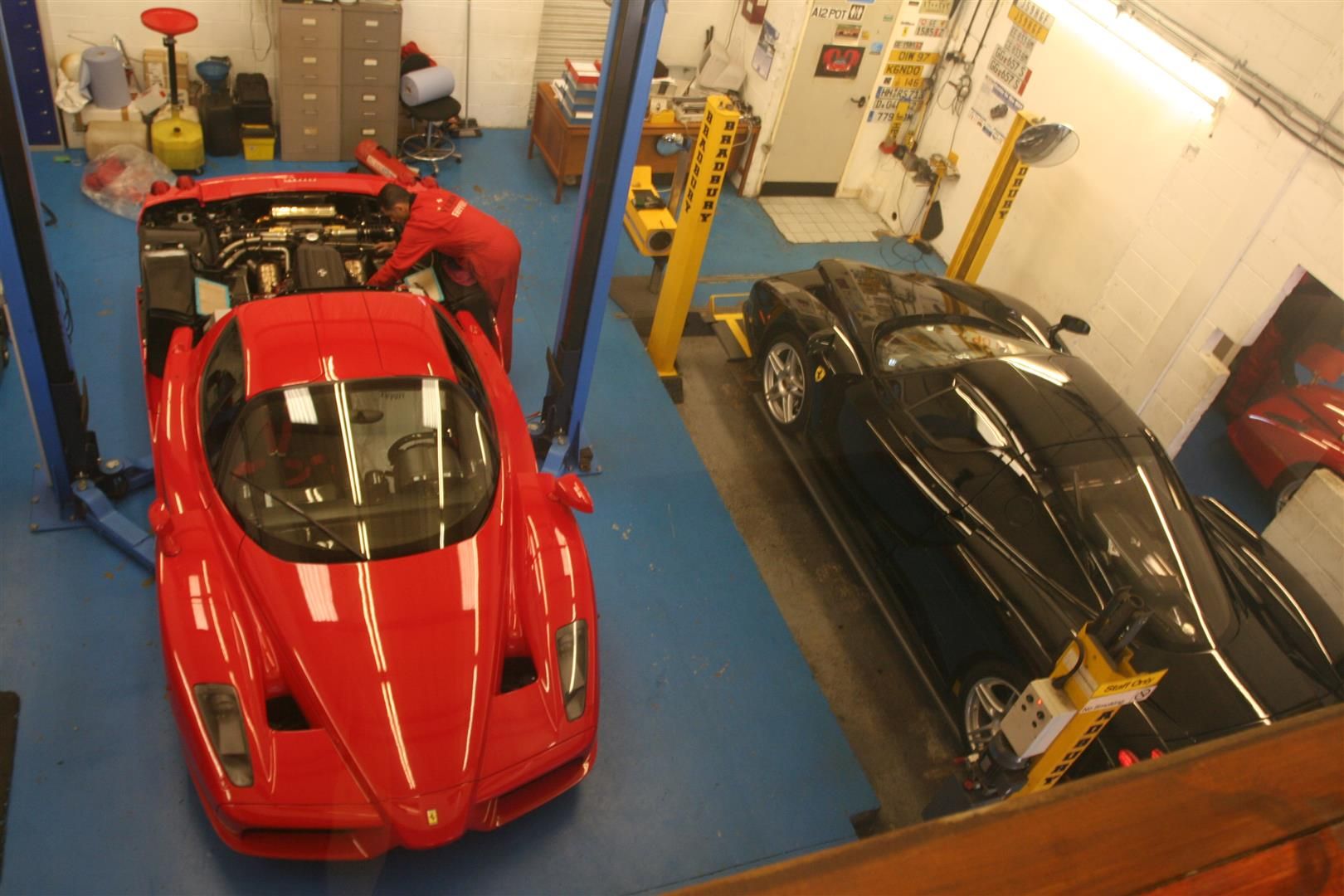 Two Ferrari Enzos in our workshop - Red and Black.